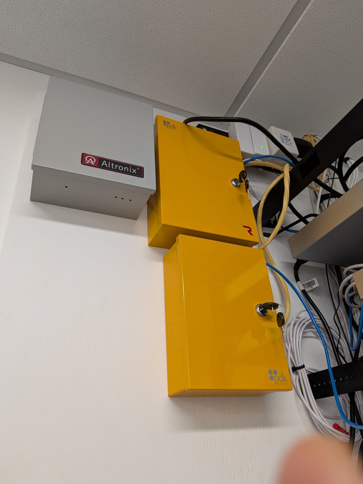 Access control controllers and power supply mounted next to the existing electrical panel