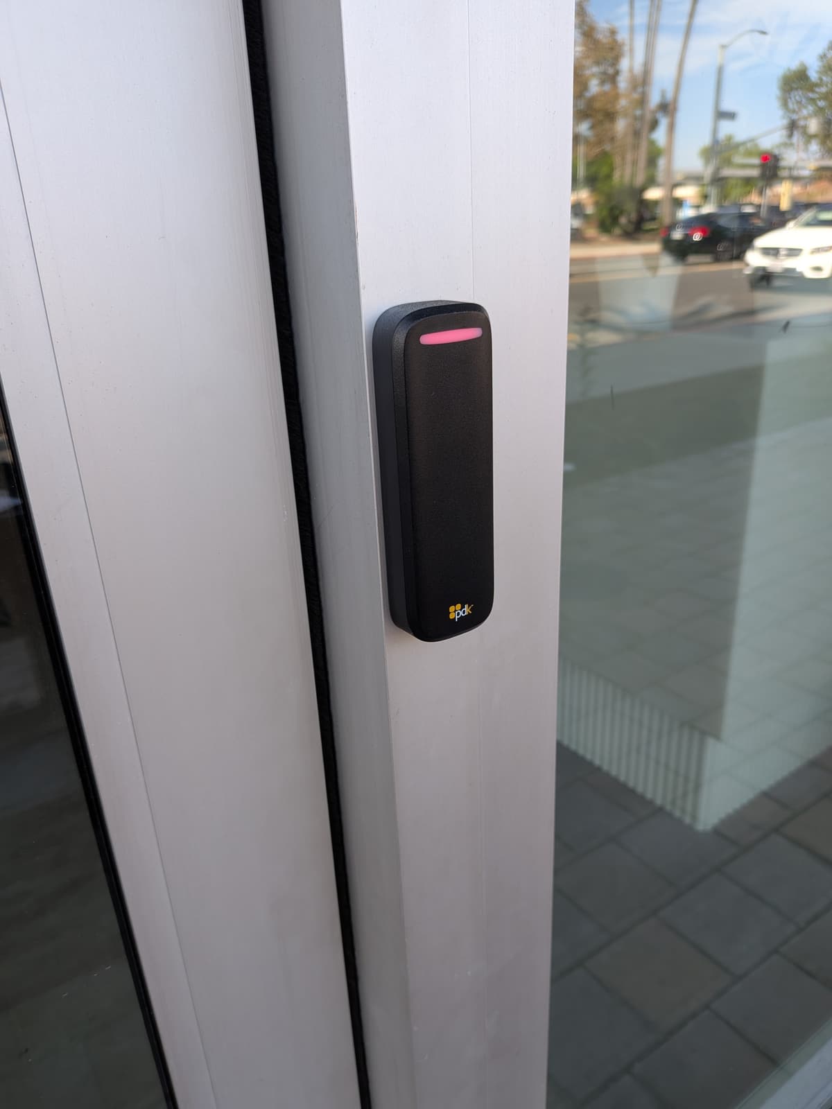 Original Bluetooth-only high-security reader on the front entrance frame