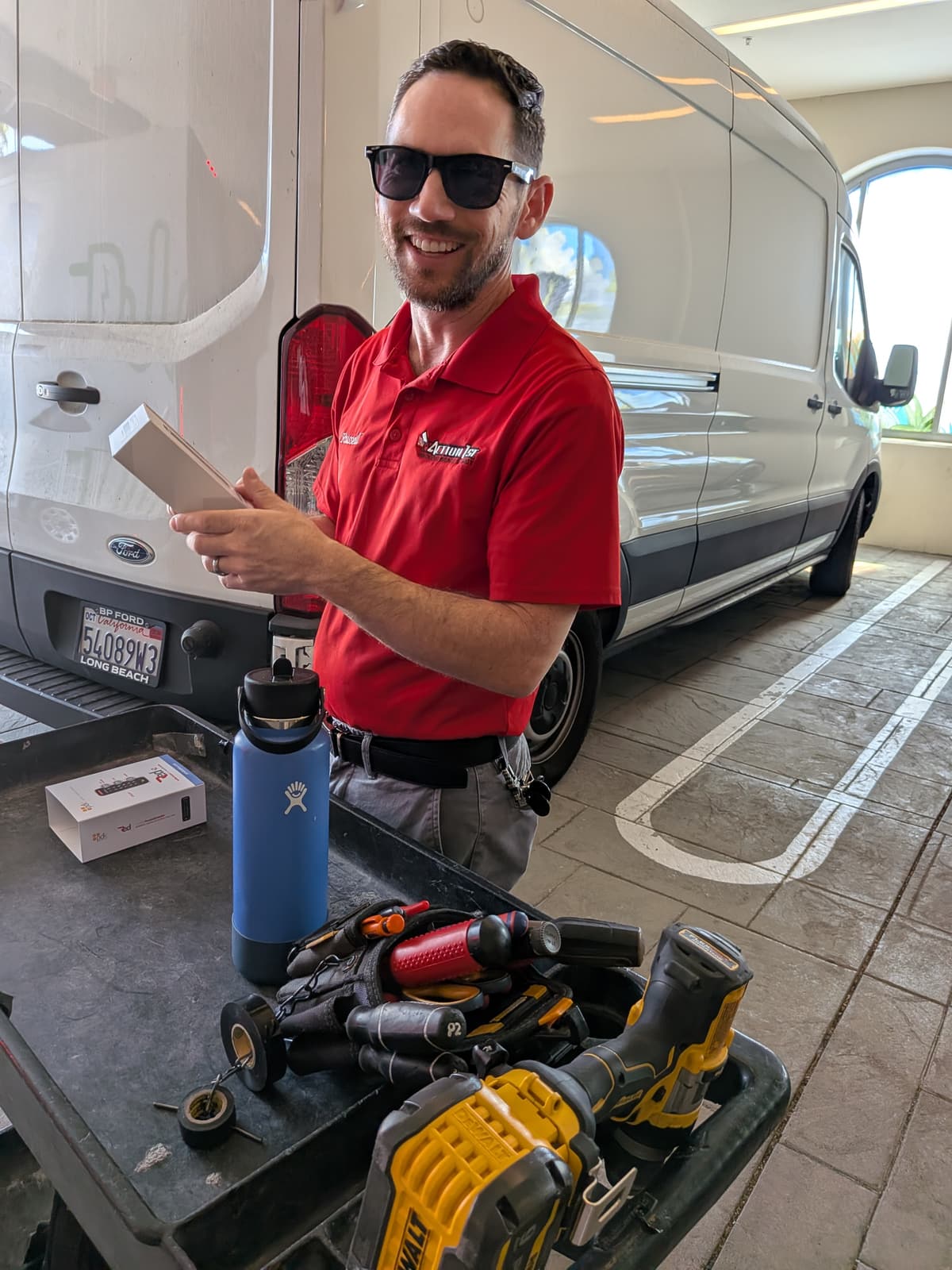 Action 1st technician at the service van preparing reader hardware for the Nu Dental Aesthetics install