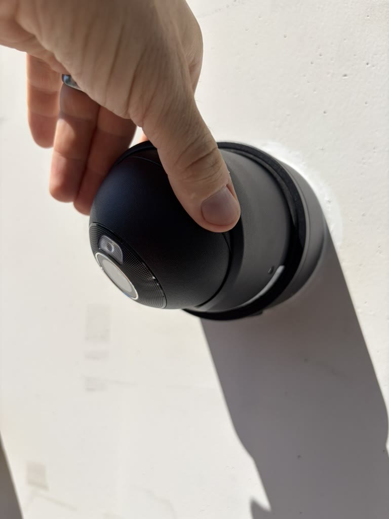 Technician aiming a newly mounted exterior security camera