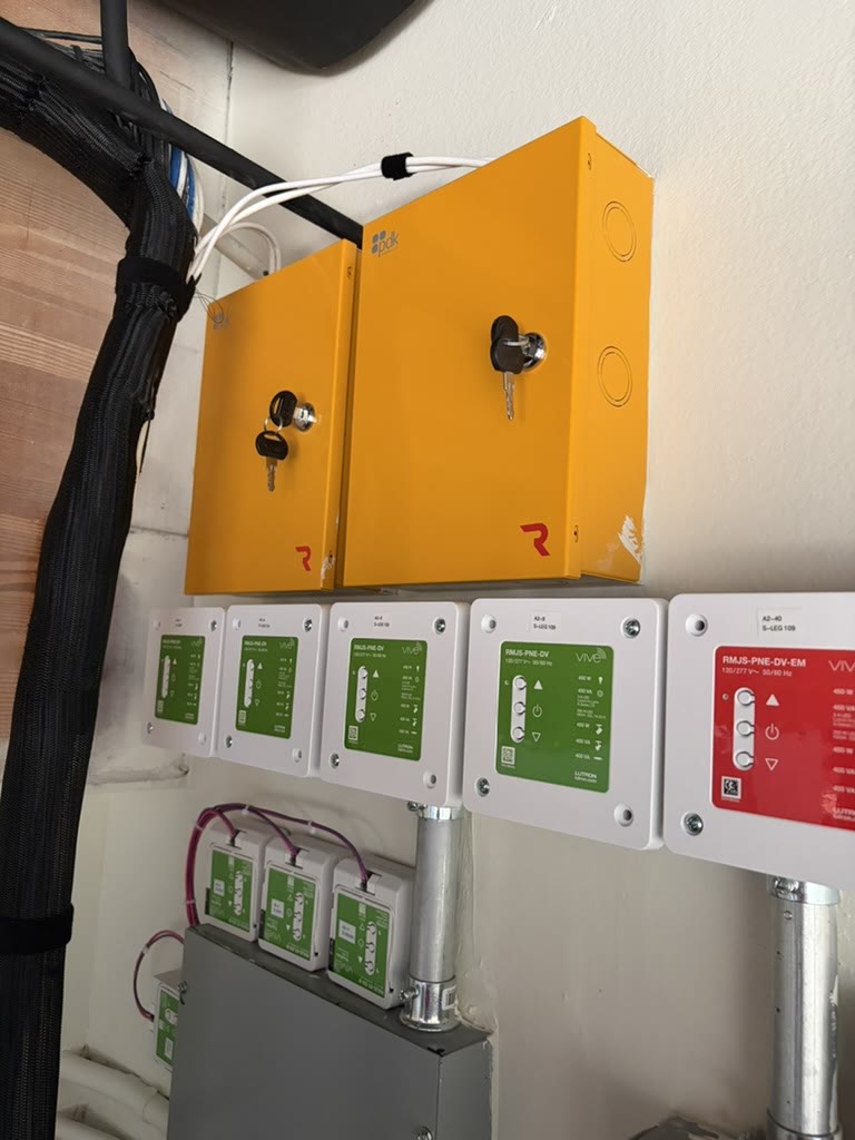 ProDataKey access panels mounted above a row of Lutron Vive lighting controls