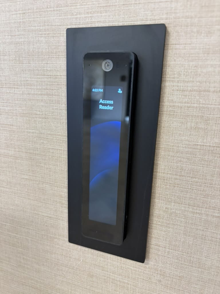 Flush-mounted touchscreen video access reader on an office wall